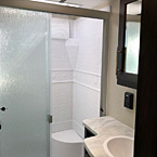 The Sanibel 3202WB bathroom is designed to bring the comforts of home with porcelain toilets, designated linen cabinets, a mirrored vanity, 40 inch shower with a bench seat and a frosted glass shower door. Complete with a pocket door for ease of entry from the hallway.